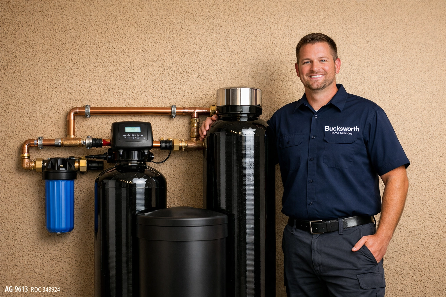 Bucksworth technician standing by a new whole-home water filtration and softener system in Maricopa, AZ.