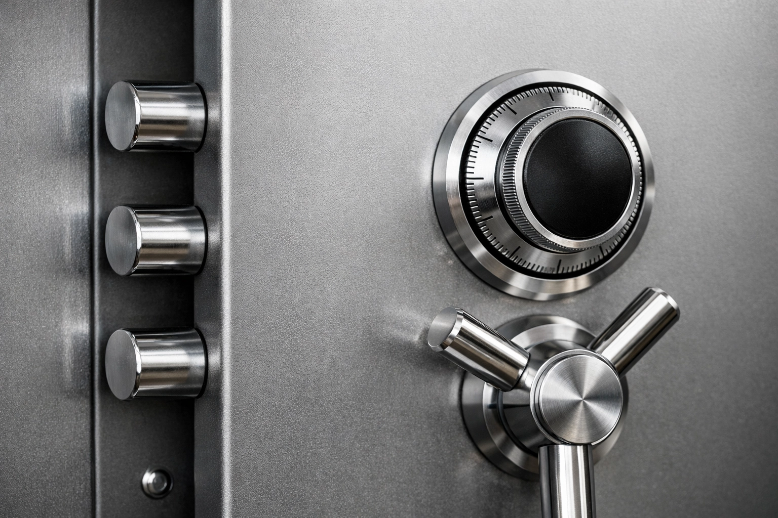 Close-up of a safe door locking bolts and mechanism, clean metallic details and uncluttered background.