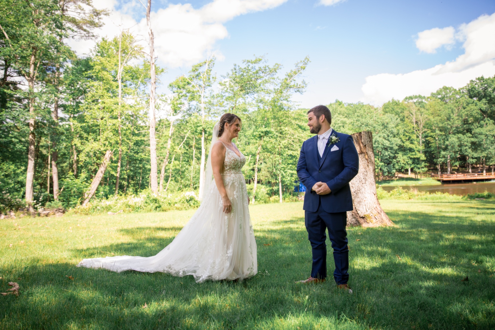 Bride and Groom First Look in a sunlit outdoor setting
