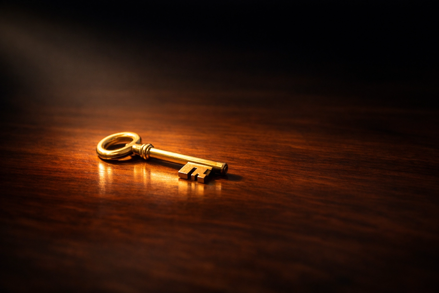 A golden key on wood symbolizing the unlocking of truth and transparency in ministry leadership.