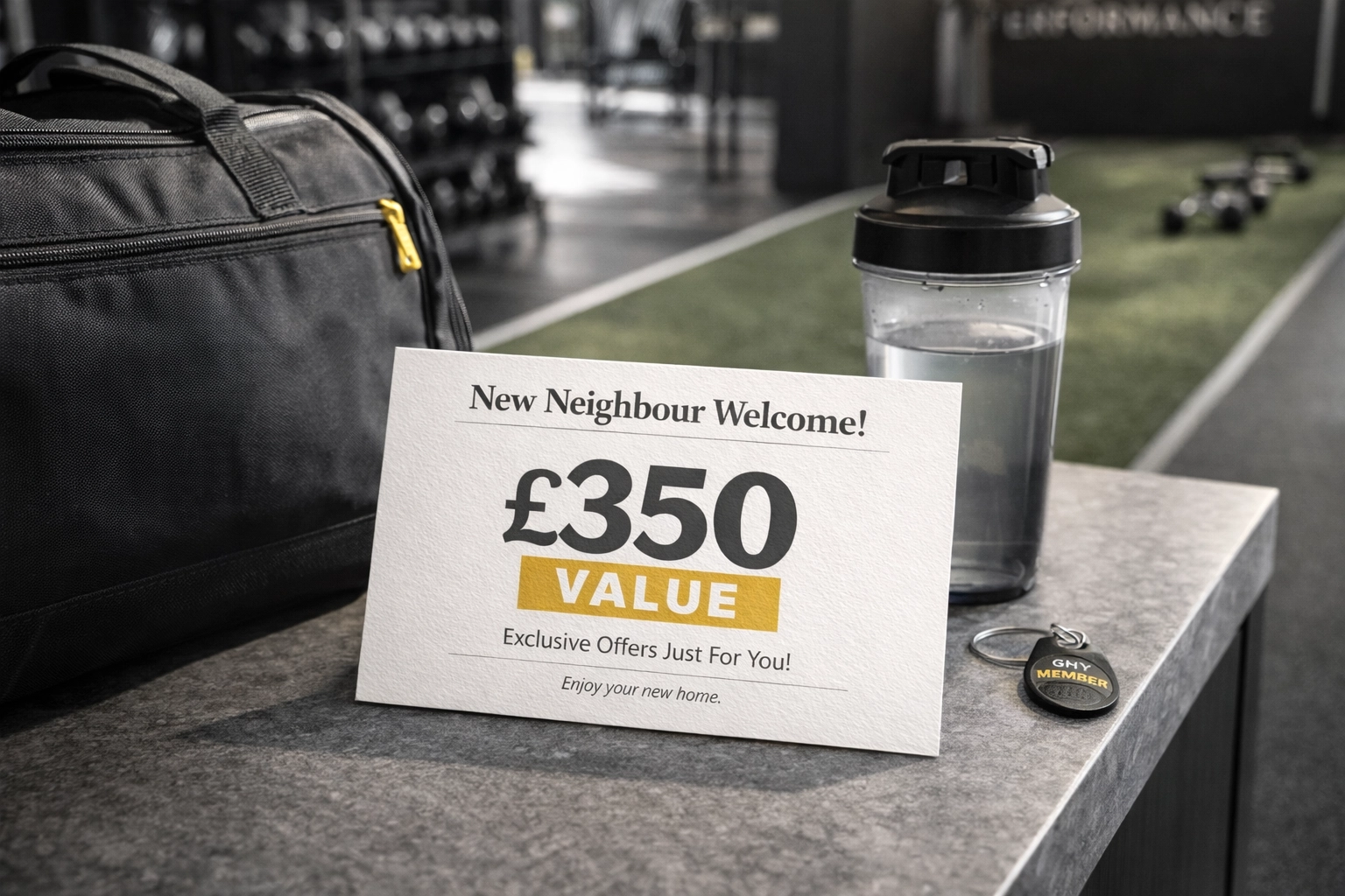 Professional UK-style A5 New Neighbour Welcome Postcard with a £350 value headline on a high-end gym reception desk or modern kitchen counter with a gym bag nearby.