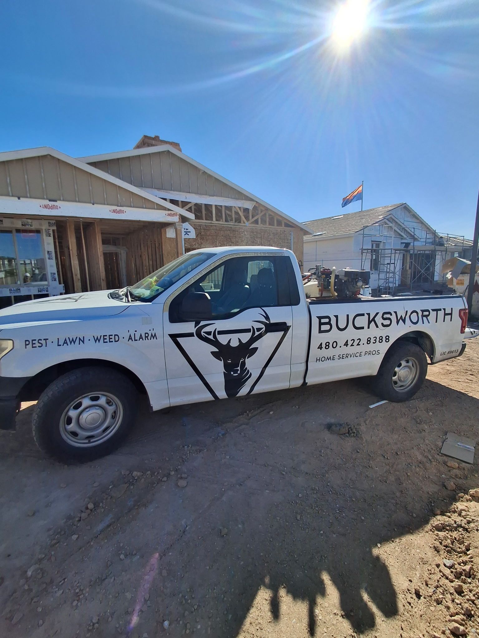 Bucksworth technician standing with Flozone backpack ready to treat a Laveen home