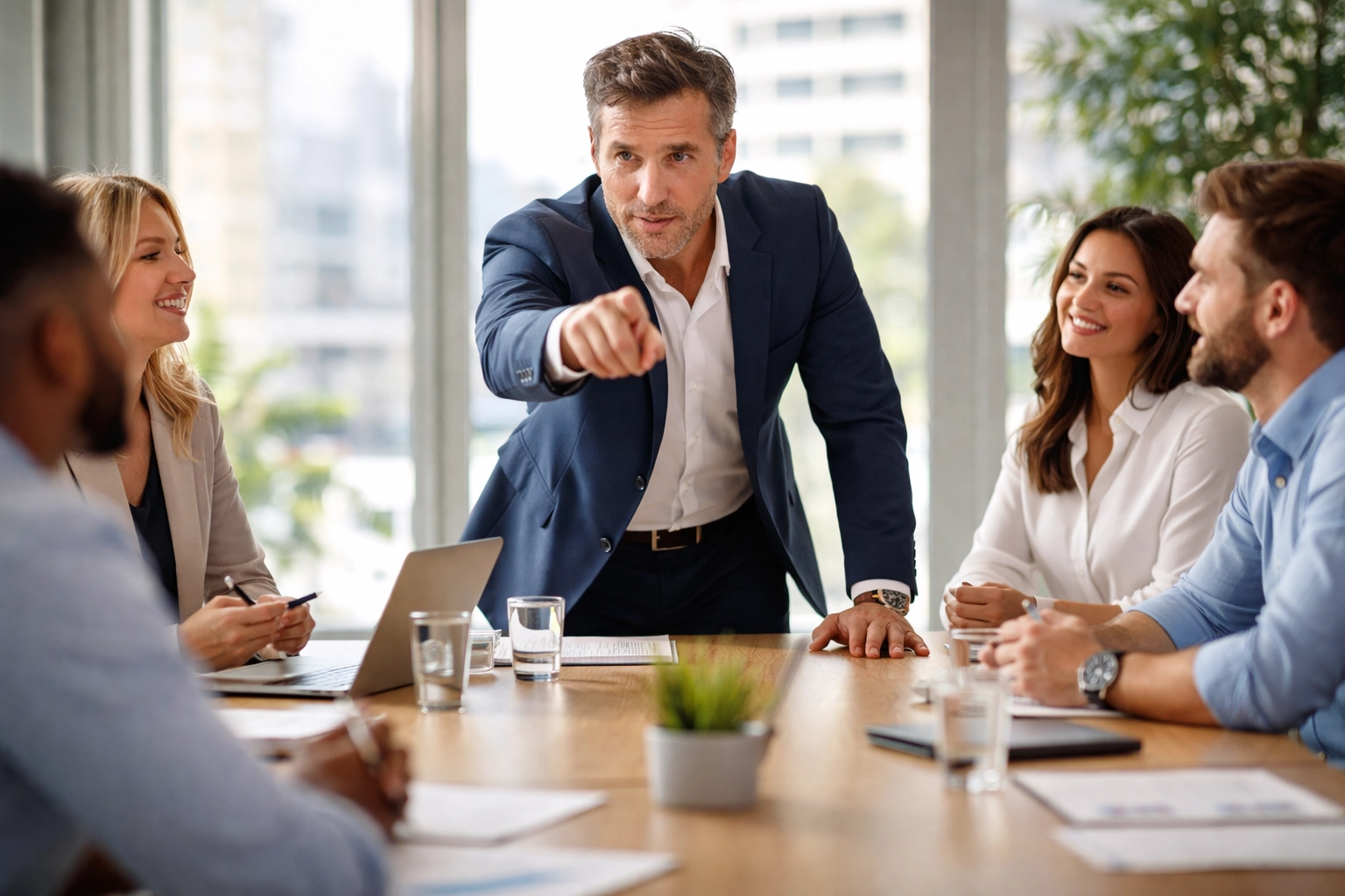 Decisive leader guiding a team at a conference table, exemplifying confident decision-making in leadership.