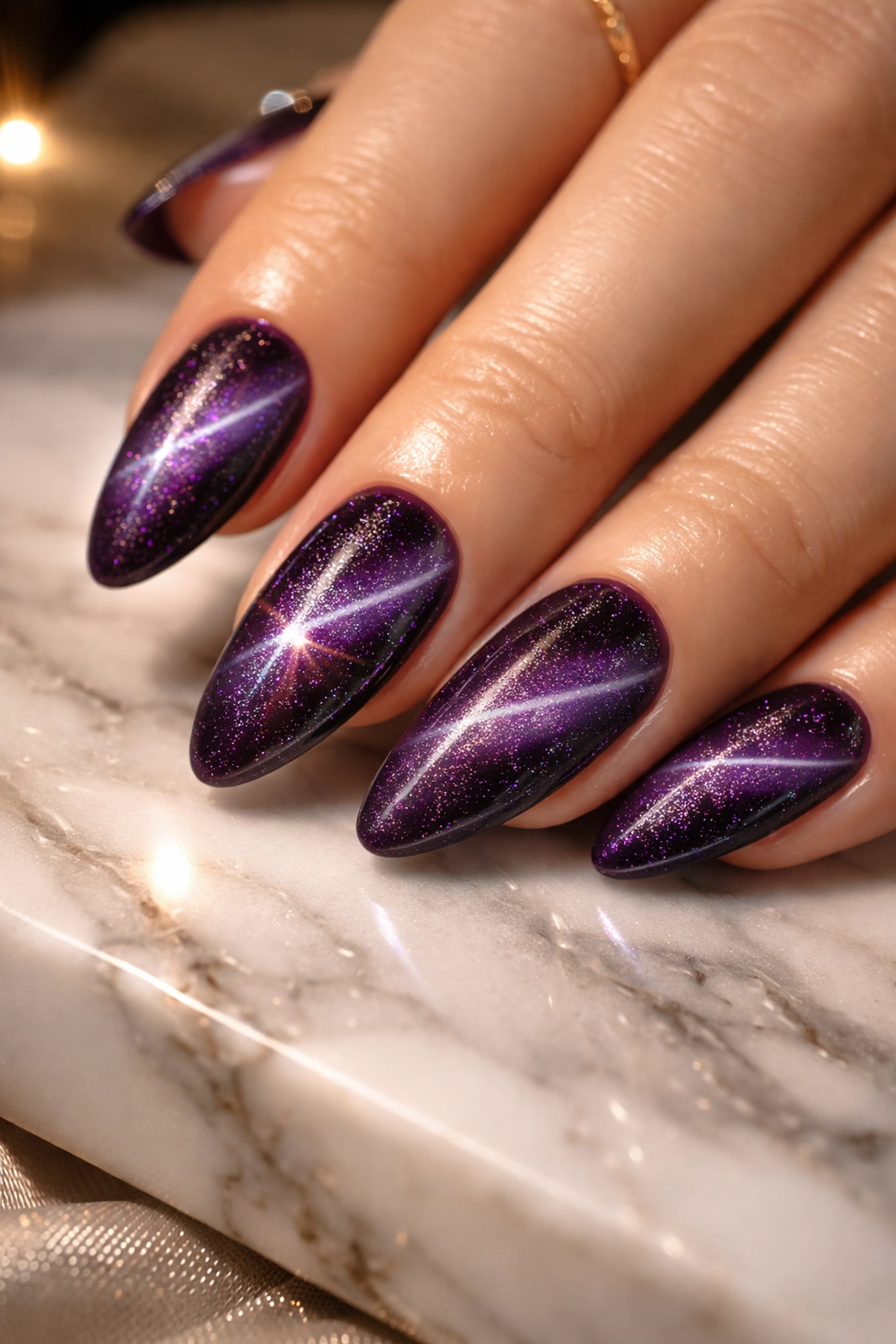 Elegant deep purple cat-eye nails with luminous magnetic streak from a Japanese gel manicure