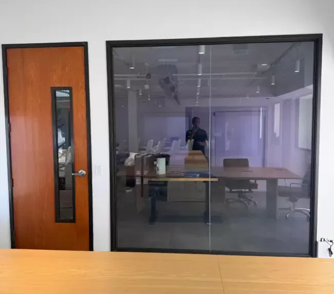 Tinted smart film applied to a consultation room window to reduce glare and ensure patient confidentiality.