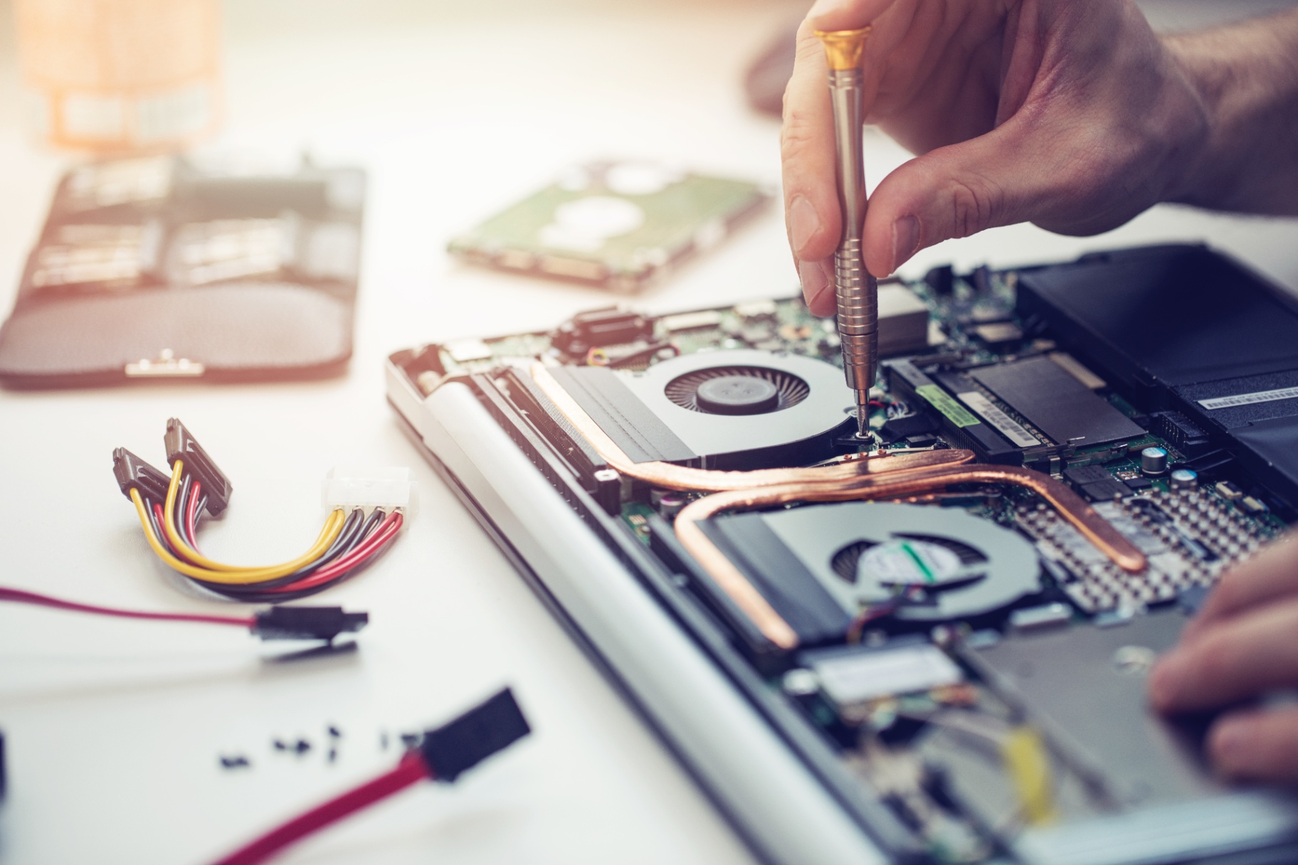 Technician Performing Laptop Maintenance