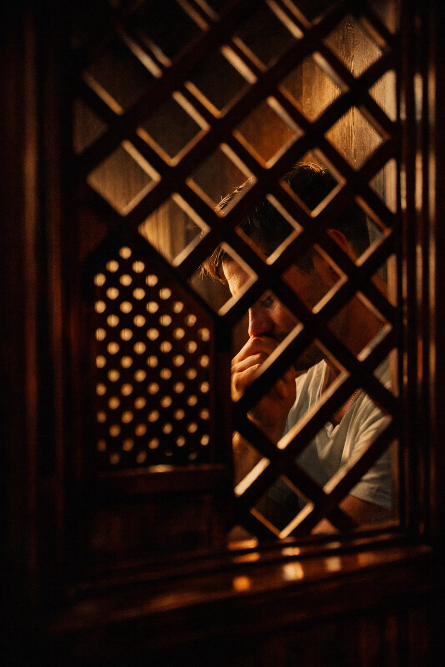 Catholic confessional booth interior in Buenos Aires church, representing priest's internal struggle