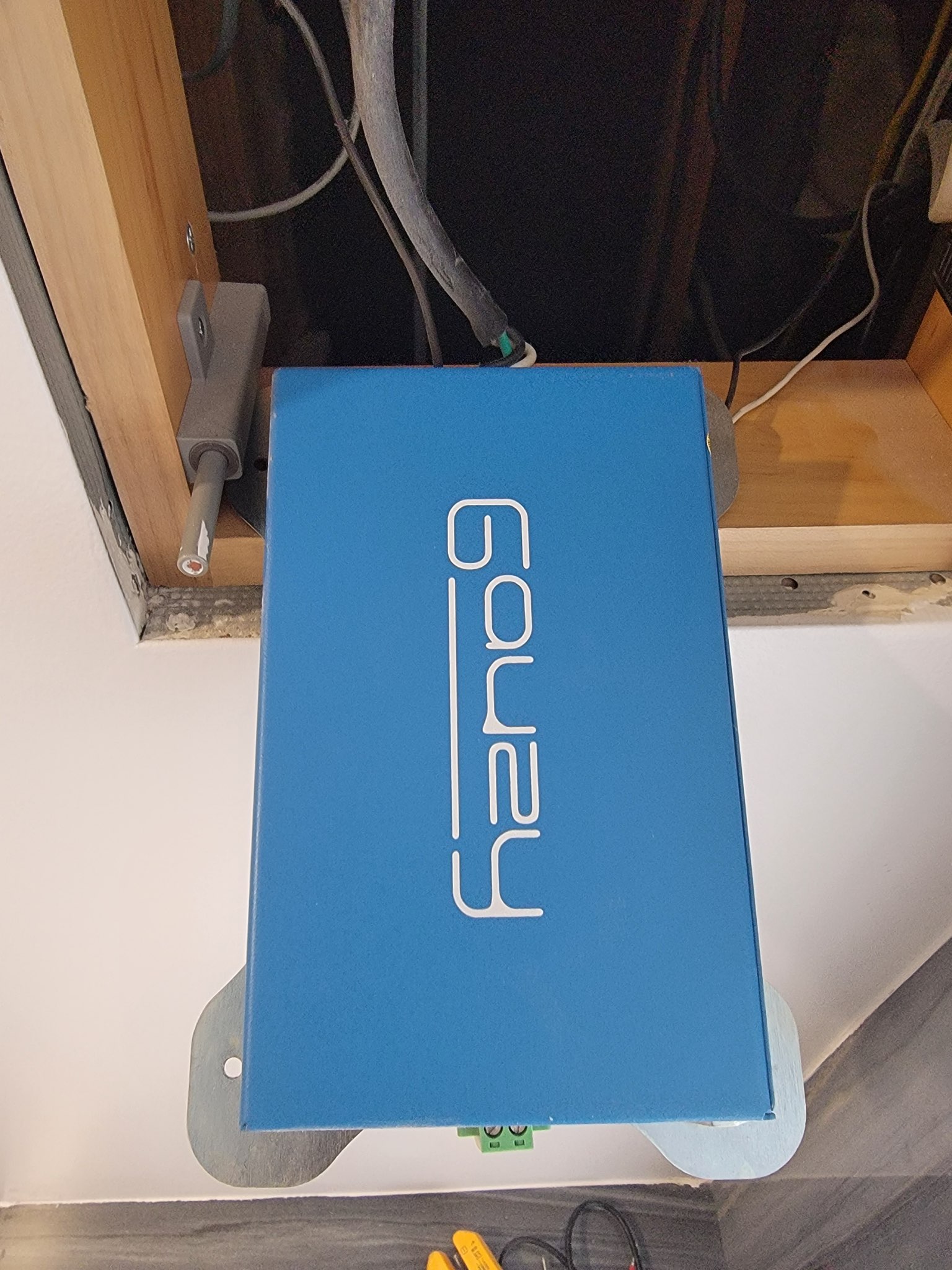 Blue smart film control box installed in wall for PDLC transformer troubleshooting and power diagnostics