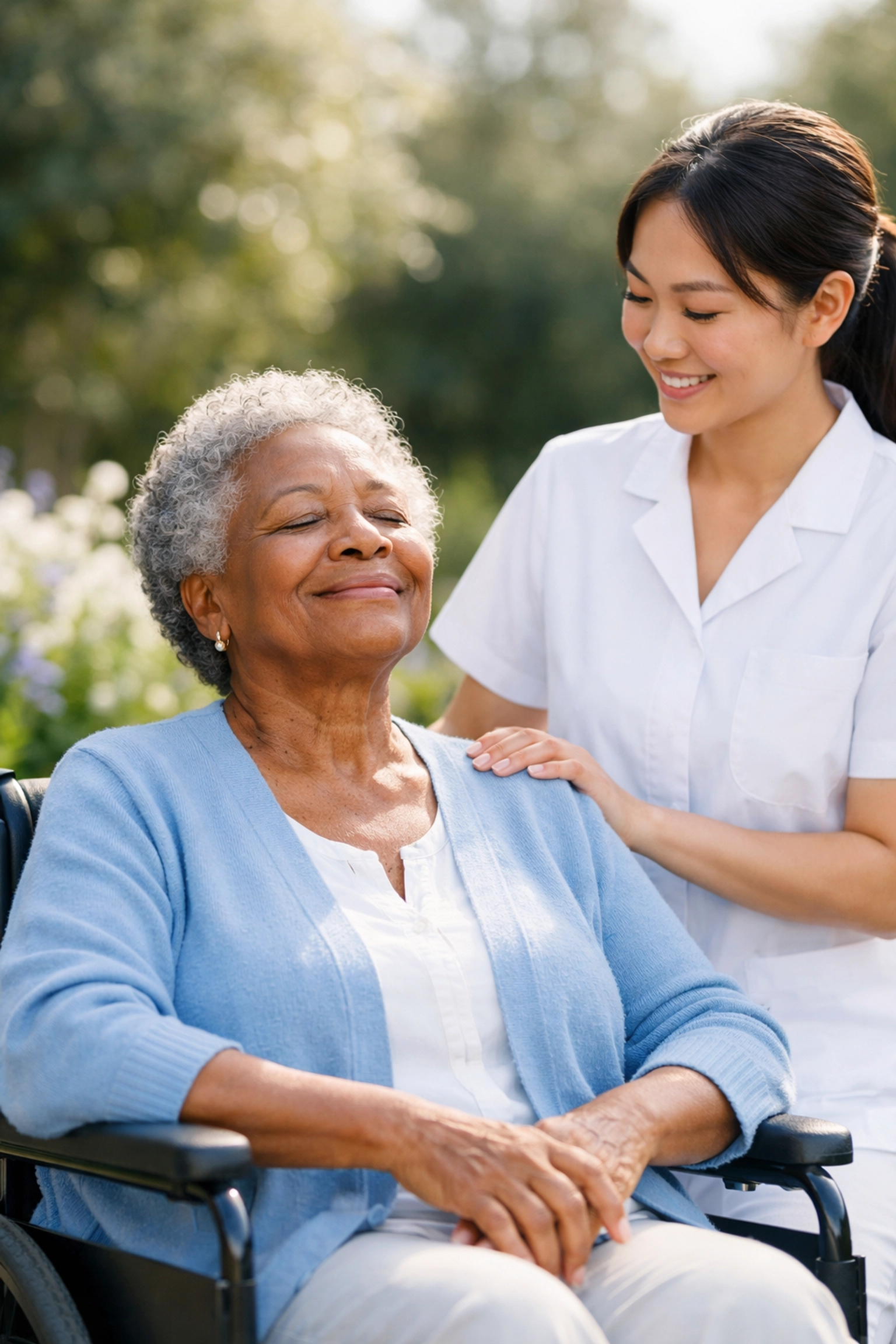 Senior woman in a wheelchair enjoying a sunlit garden with a caregiver in Manassas, Virginia.