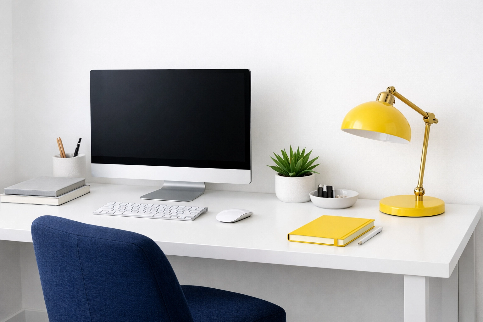 House cleaning for focus - clean minimalist home office with navy blue and subtle yellow accents