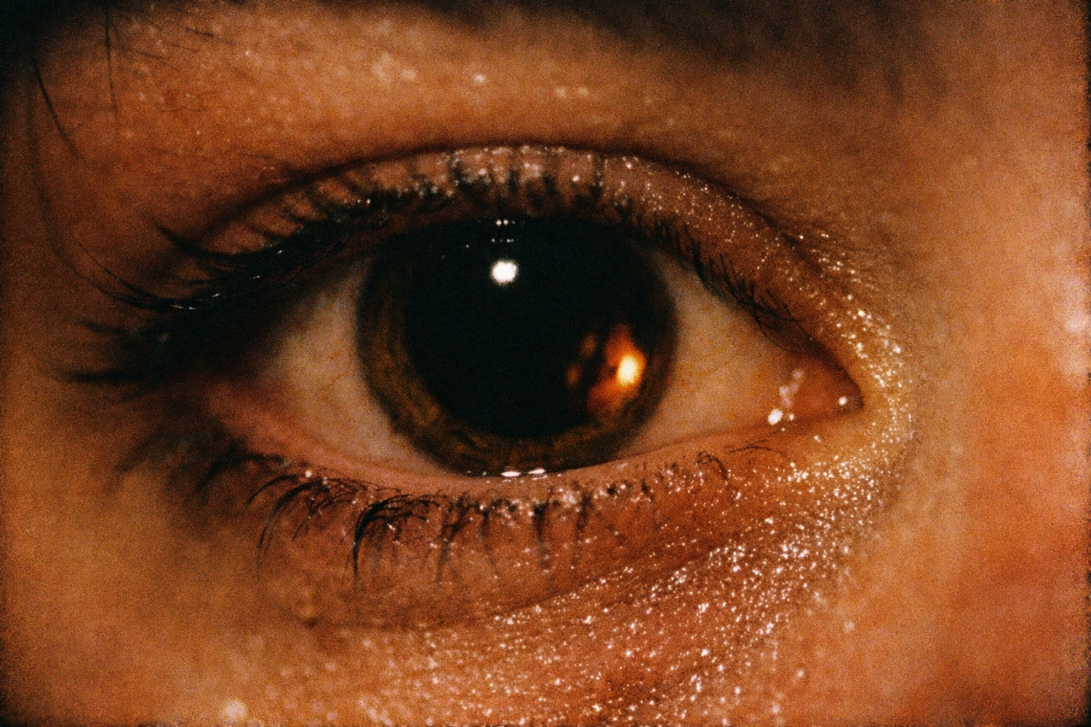 Close-up of a dilated pupil reflecting light, showing the physiological effects of BDSM headspace.