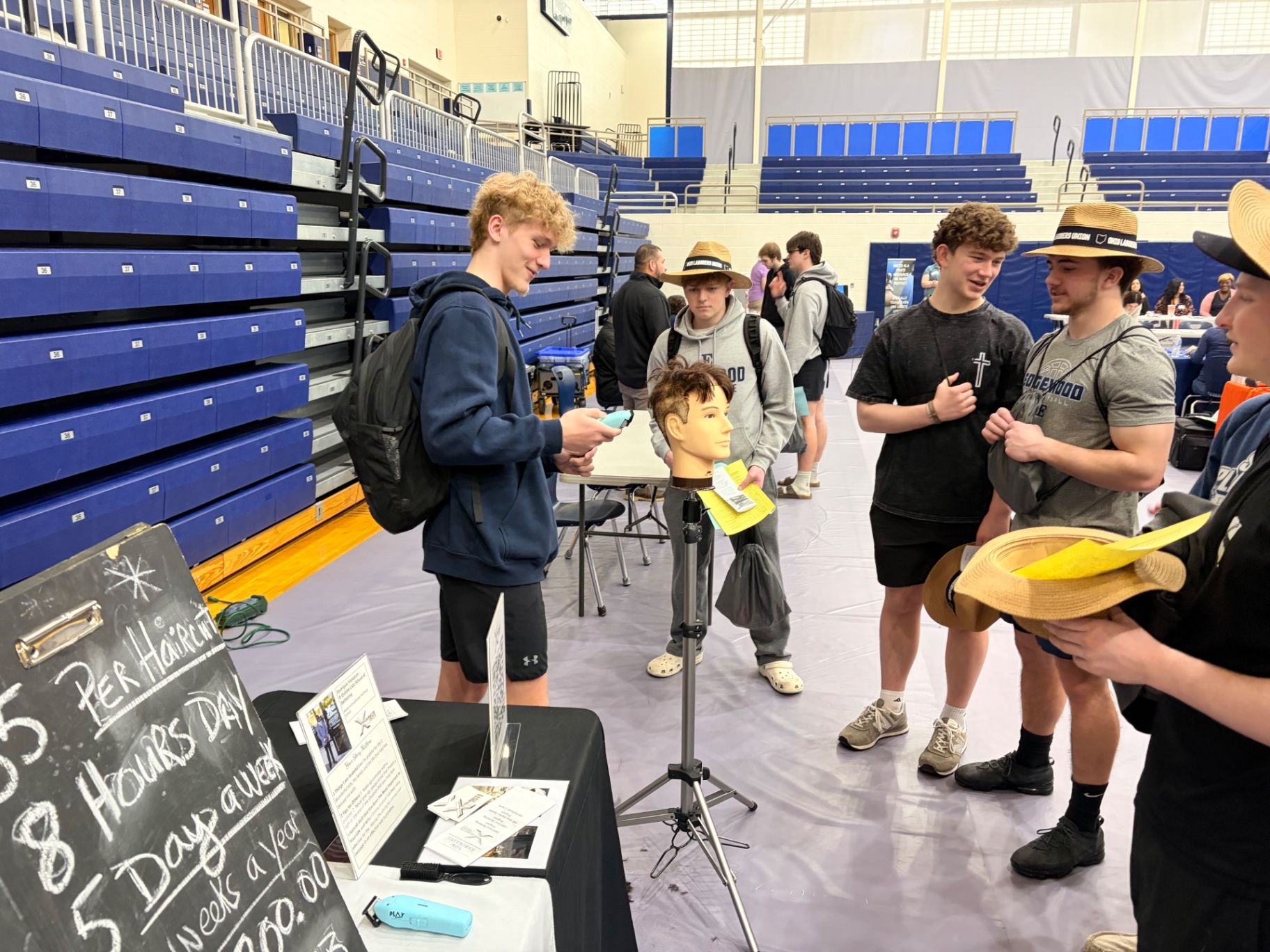 Career exploration and program stats displayed during Edgewood High School Career Fair outreach, barbering career pathway, licensing outcomes.