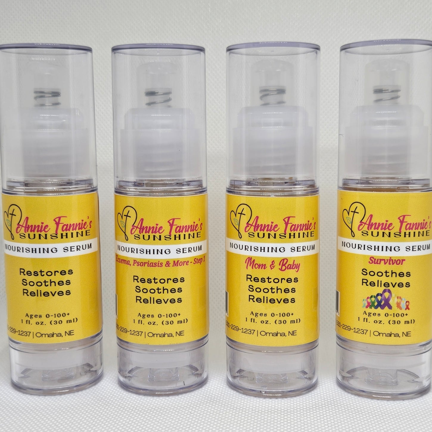 Four Annie Fannie’s Sunshine Nourishing Serums displayed in clear pump bottles