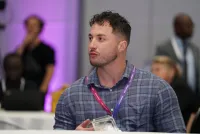 A conference attendee with a summit badge