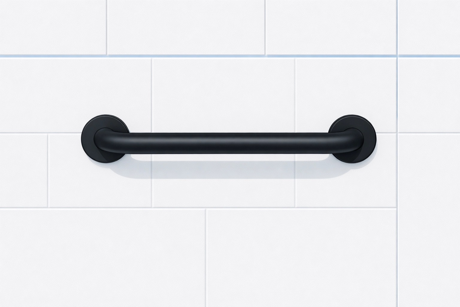 Minimalist matte black bathroom grab bar mounted on grey tiles to prevent household slips.