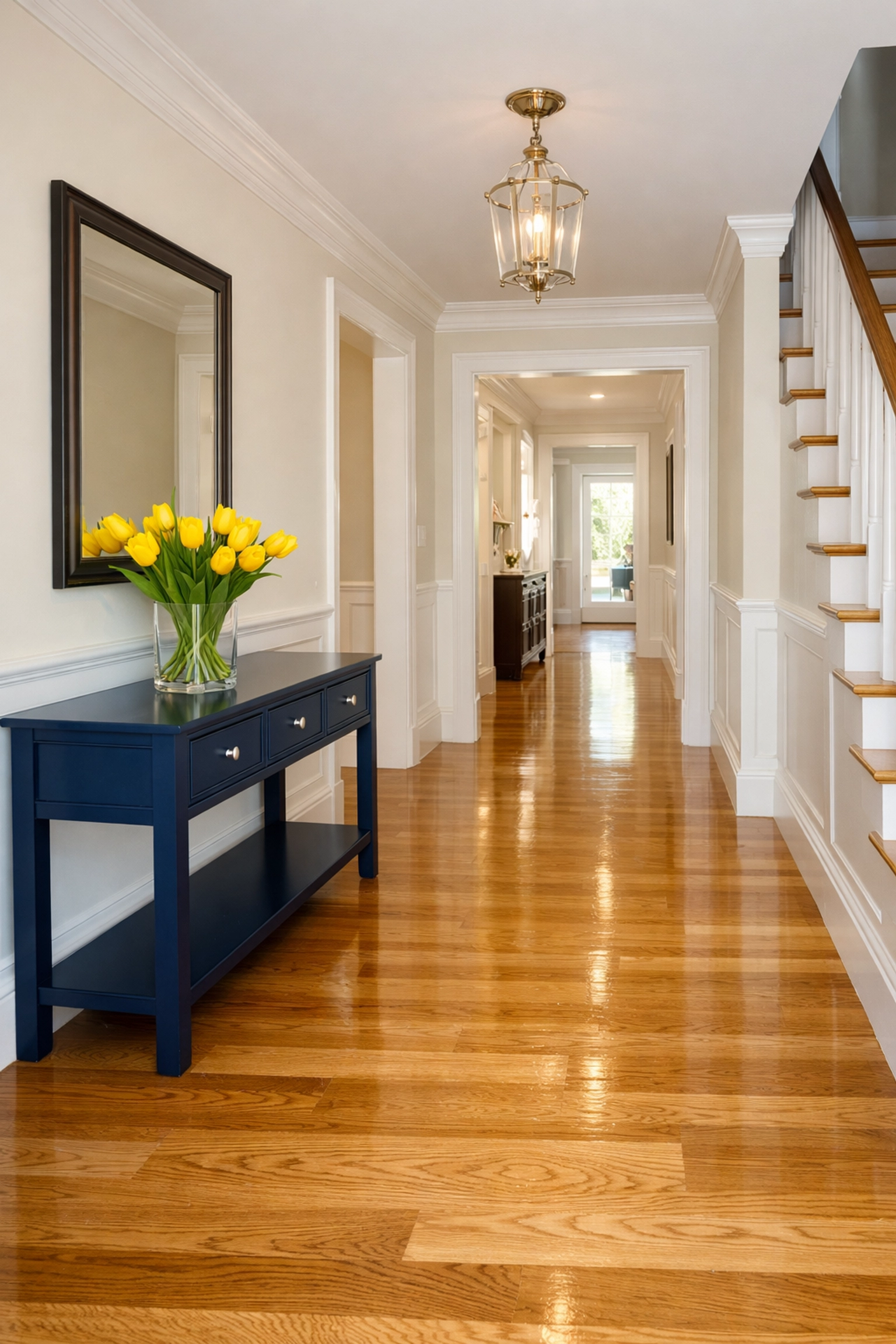 Spotless Newton home entryway with gleaming hardwood floors and fresh air after expert deep cleaning.