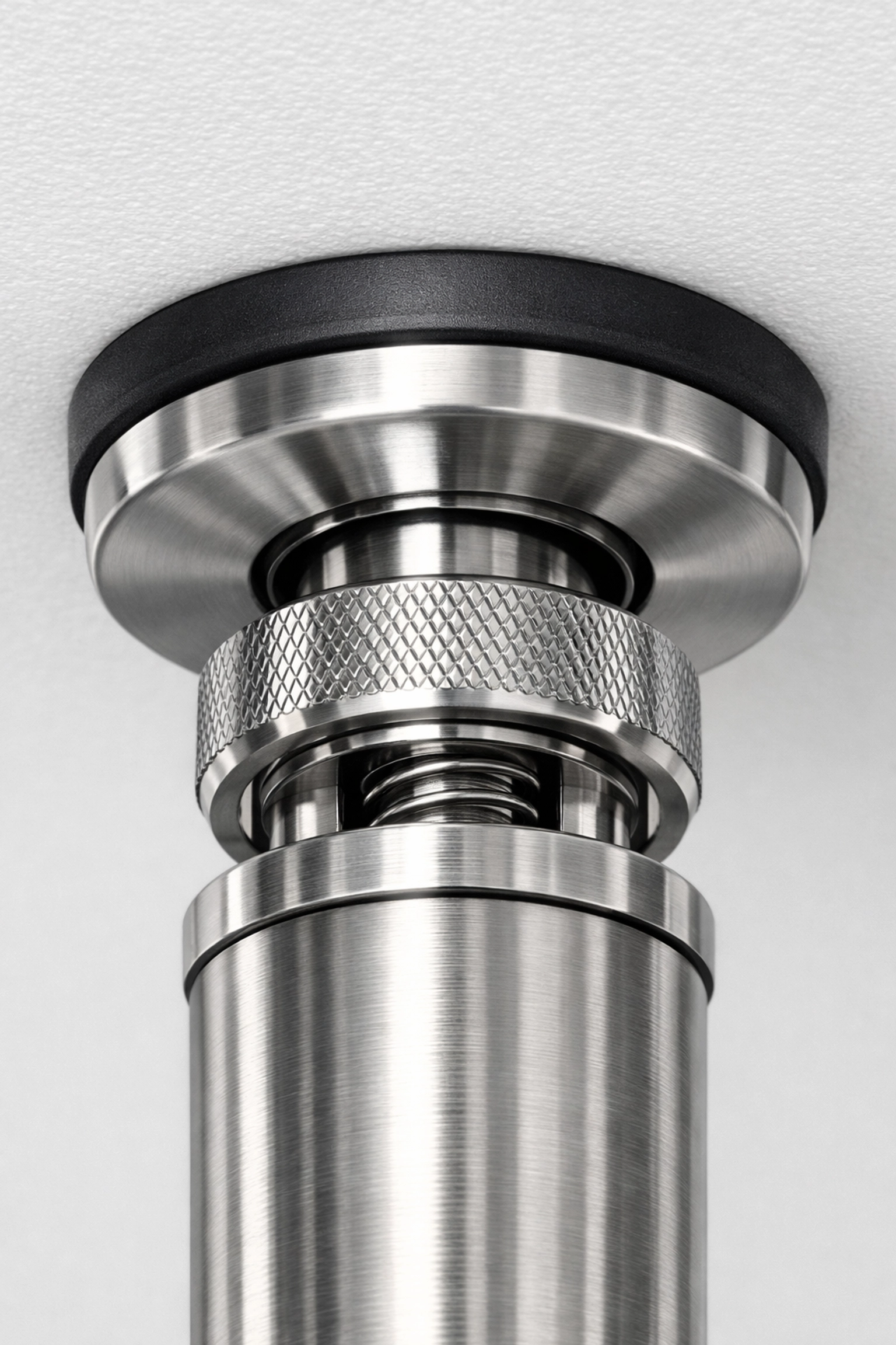 A no wall damage workout system ceiling mount designed for home resistance training.