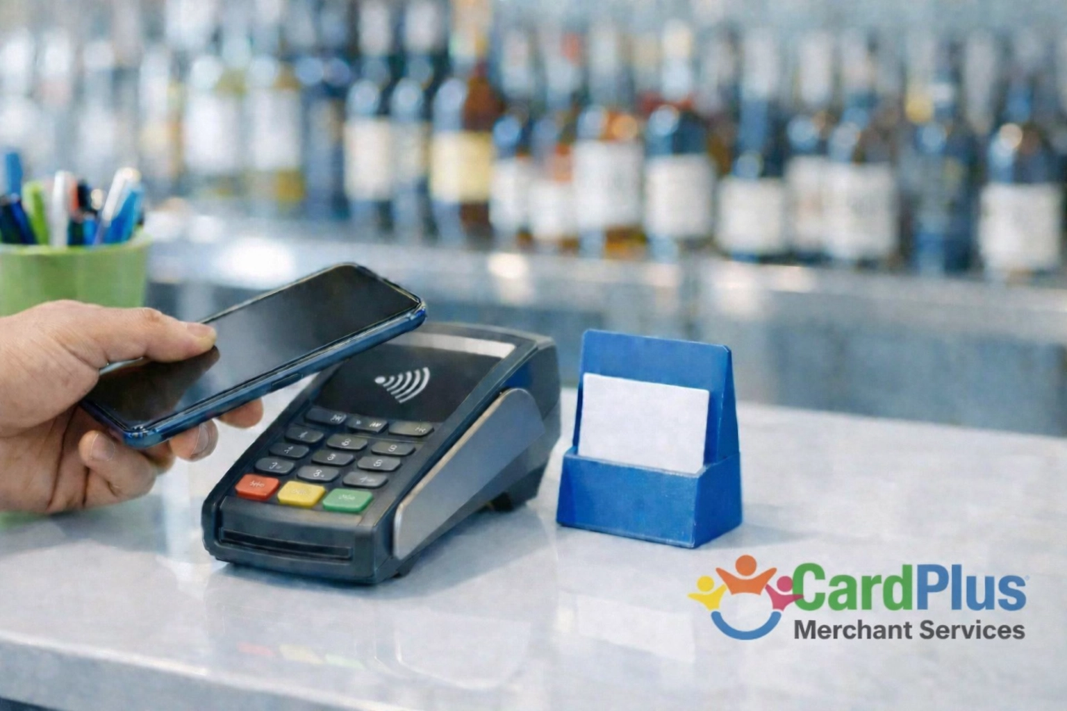 GOKUL + CardPlus: Modern contactless payment at a liquor store counter using a sleek payment terminal.