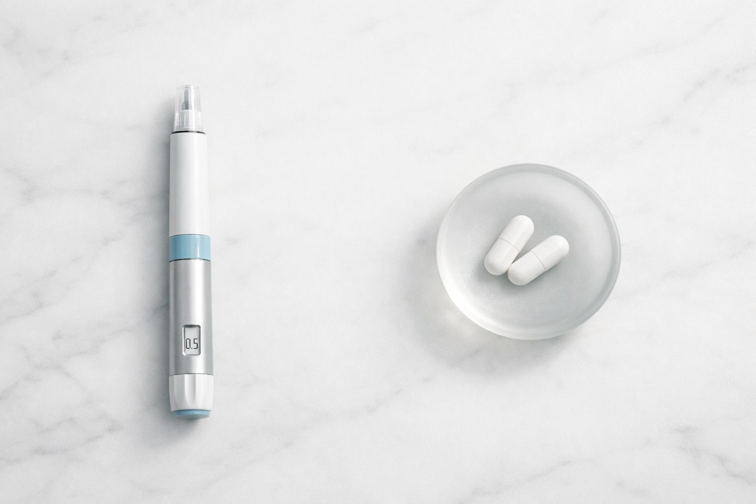 Comparison of a medical weight loss injection pen and oral capsules on a clean white surface.