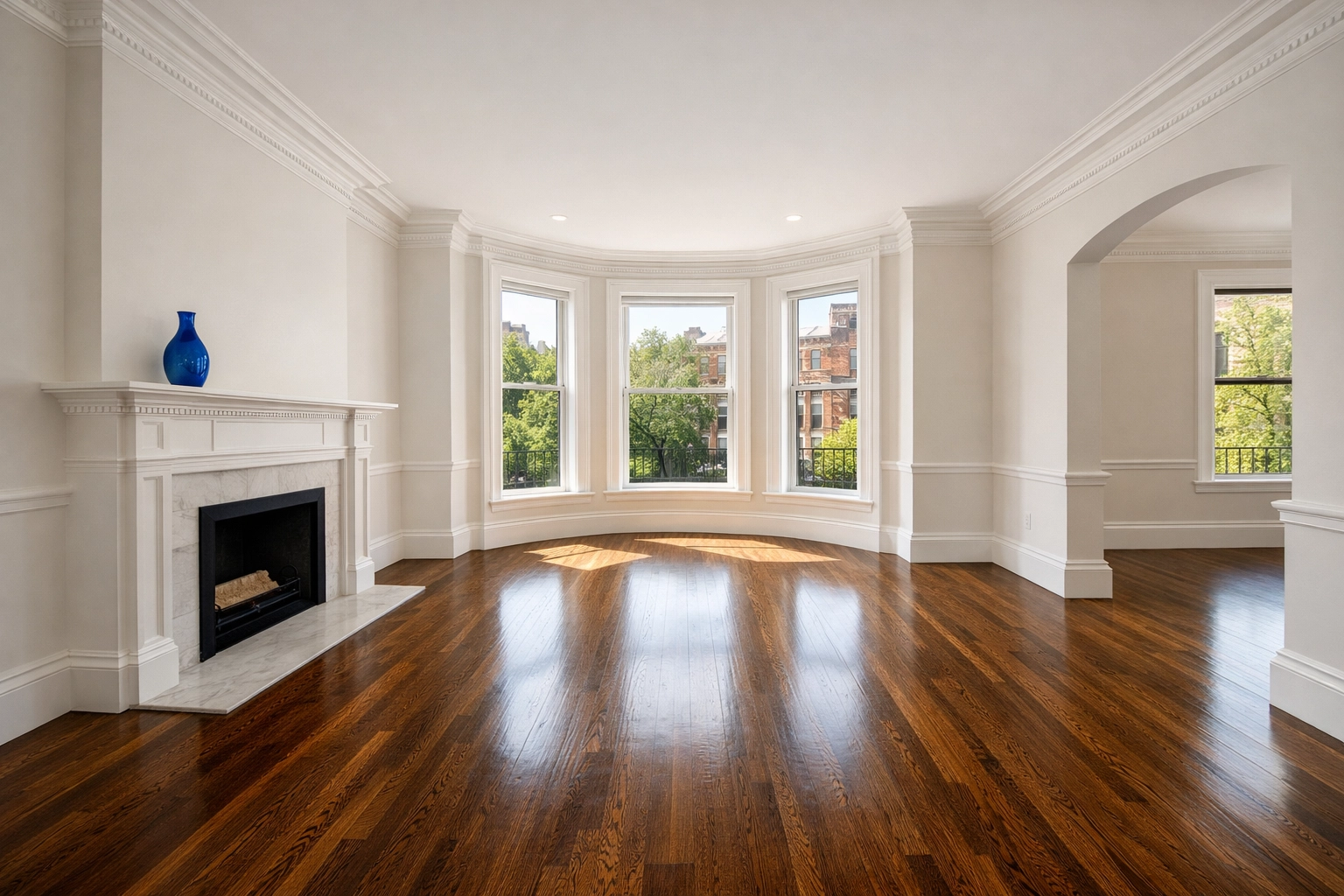 Professionally cleaned luxury Boston apartment living room with polished floors and crown molding.