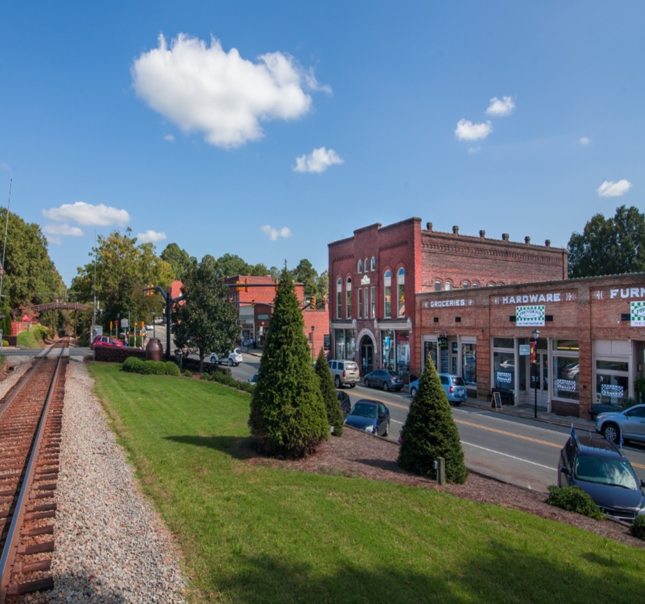 Historic Downtown Waxhaw with brick buildings and railroad tracks