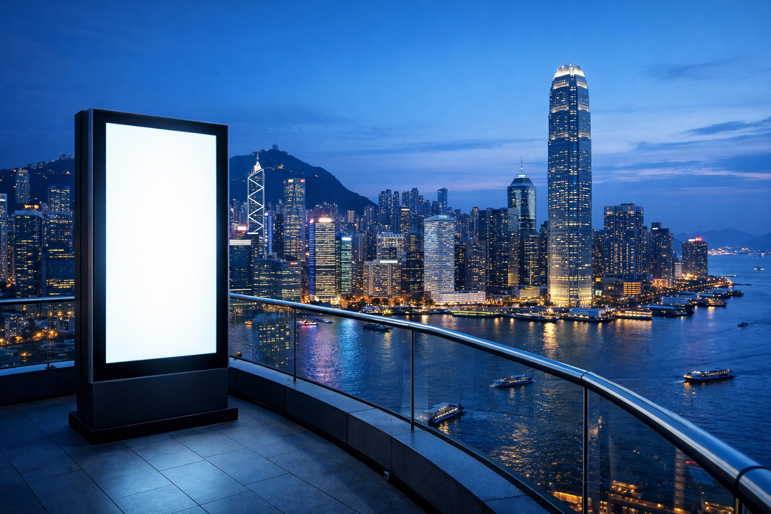 Modern digital ad screen overlooking the dense Hong Kong city skyline and harbor.