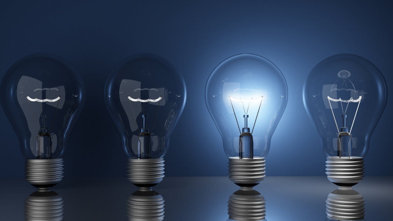 Four light bulbs aligned, third bulb illuminated