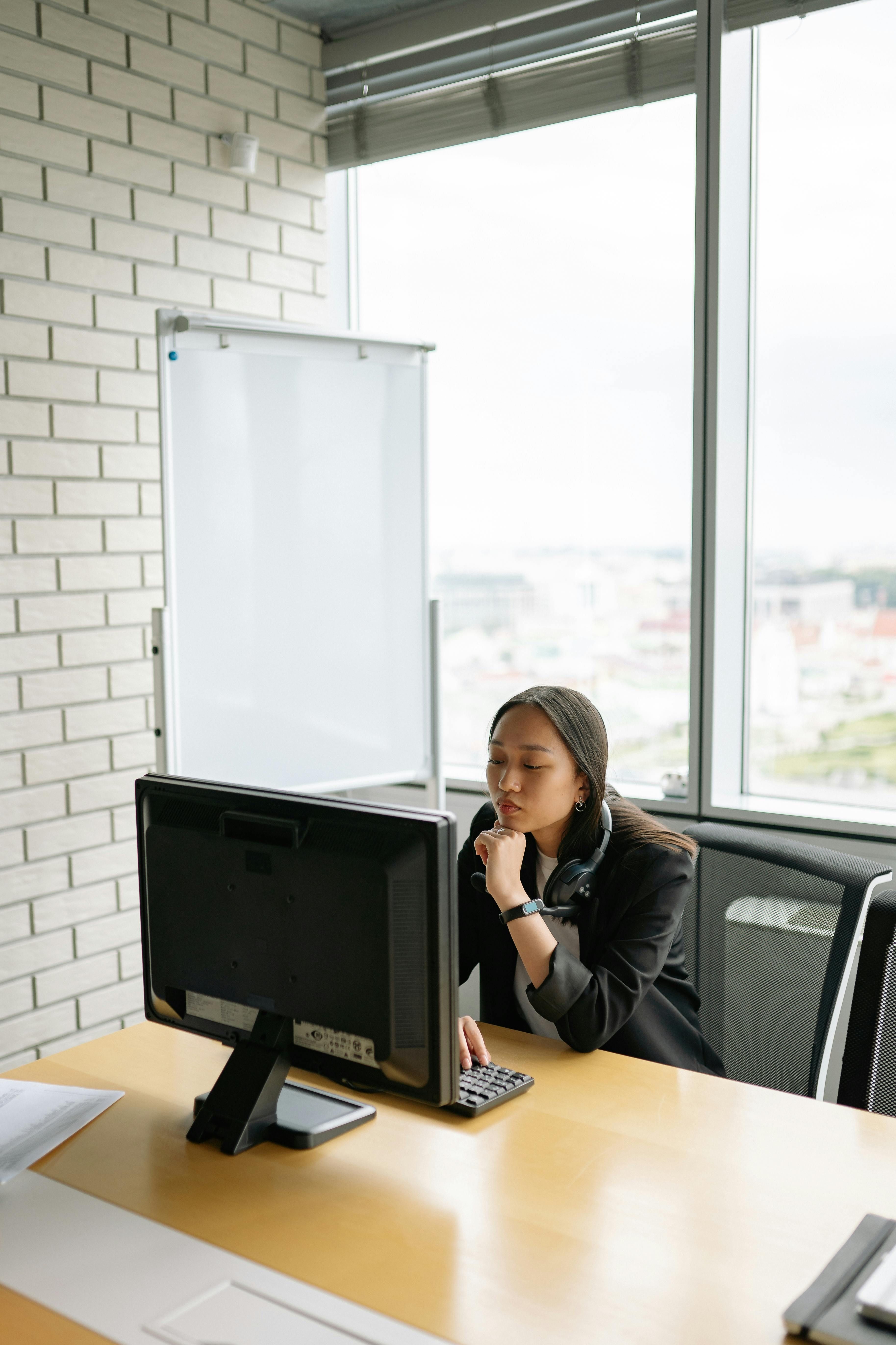 Focused remote operations woman in modern office