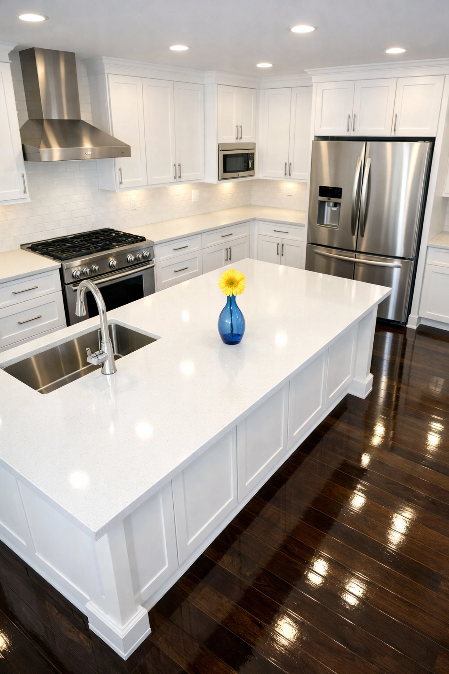 Gleaming luxury kitchen cabinets and counters following professional house cleaning in Maynard, MA for new residents.