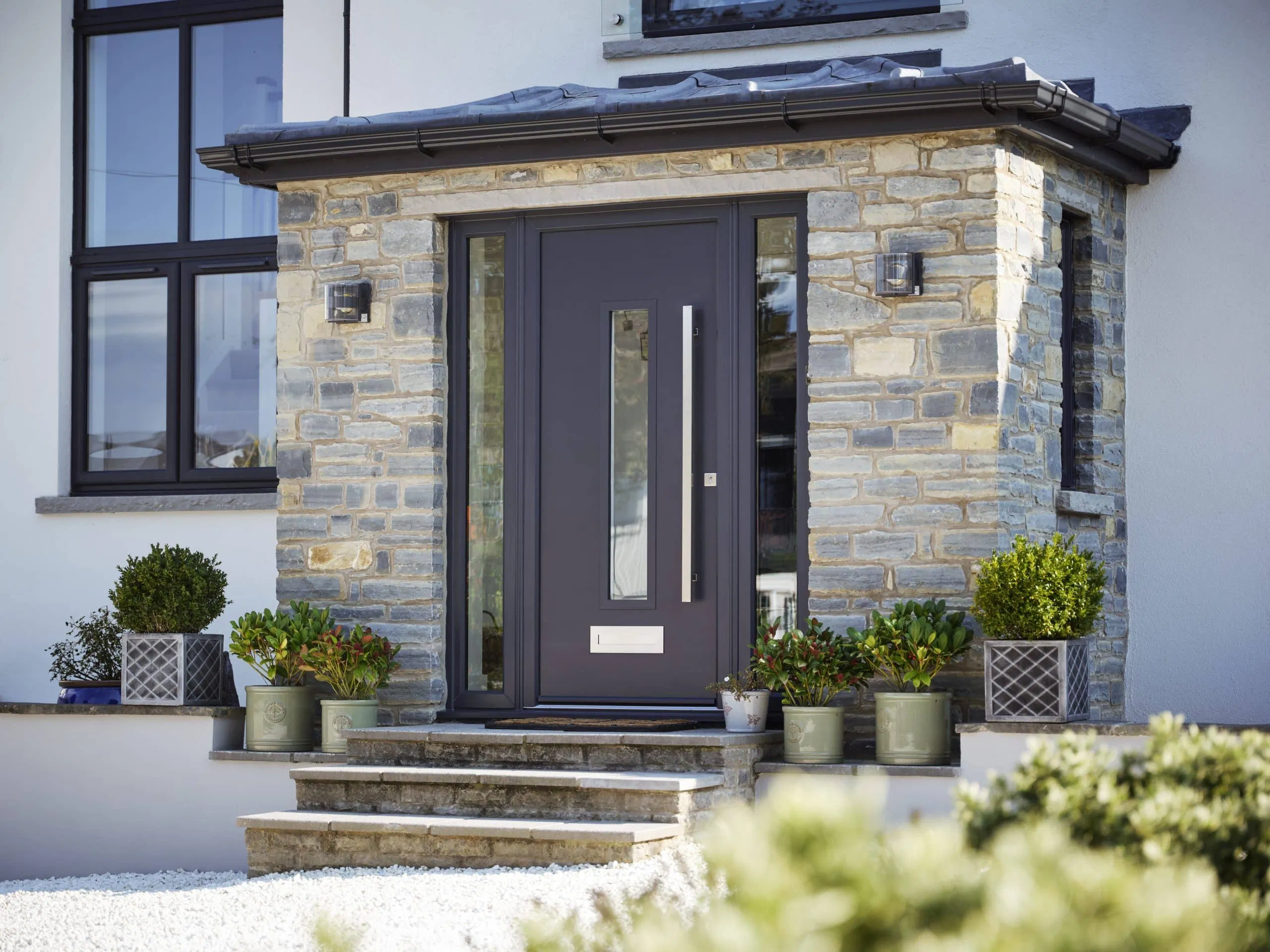 Contemporary grey front door with secure glass inserts