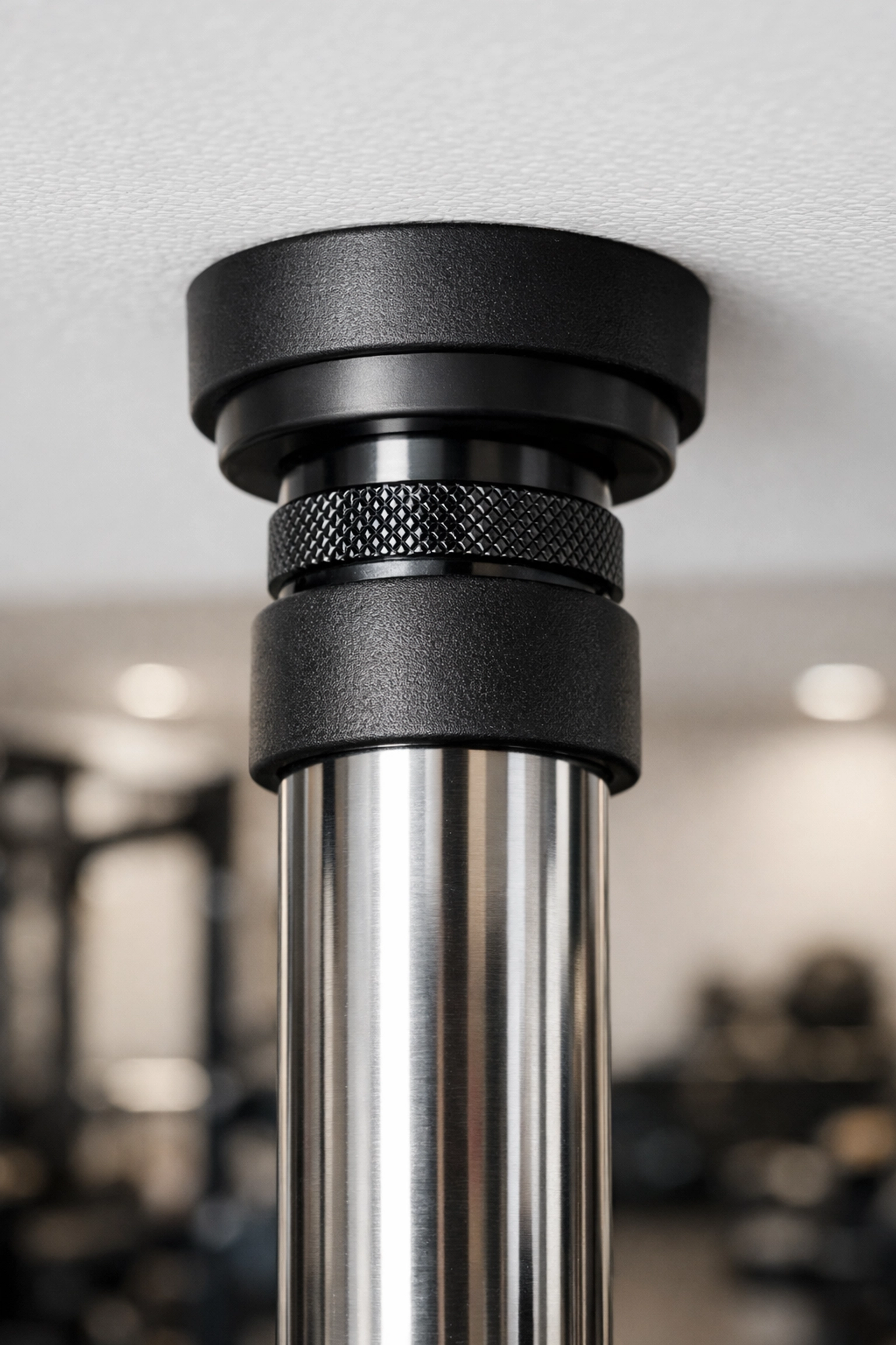 Close-up of a no wall damage workout system showing the tension anchor point with protective rubber padding.