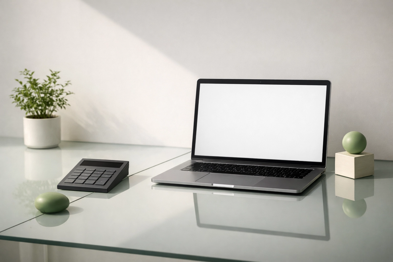 Premium minimalist finance setup with a sleek laptop, geometric shadows, and green accents symbolizing burn rate and runway management.