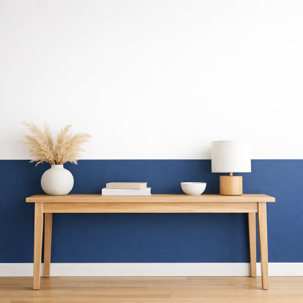 Navy blue and white two-tone hallway wall showcasing a clean colour capping paint technique.