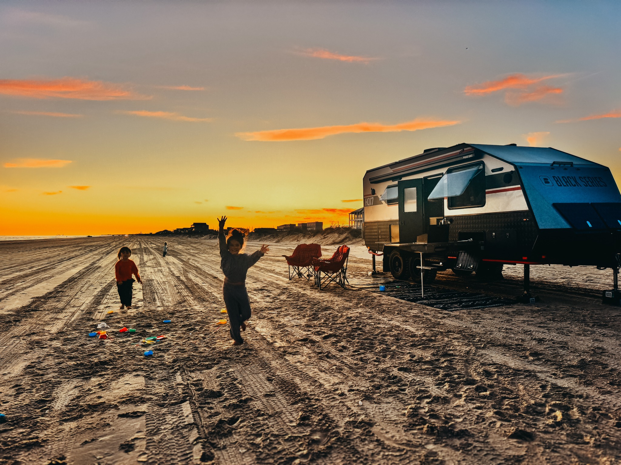 Black Series HQ17 Off-road Travel Trailer on Sandy Beach