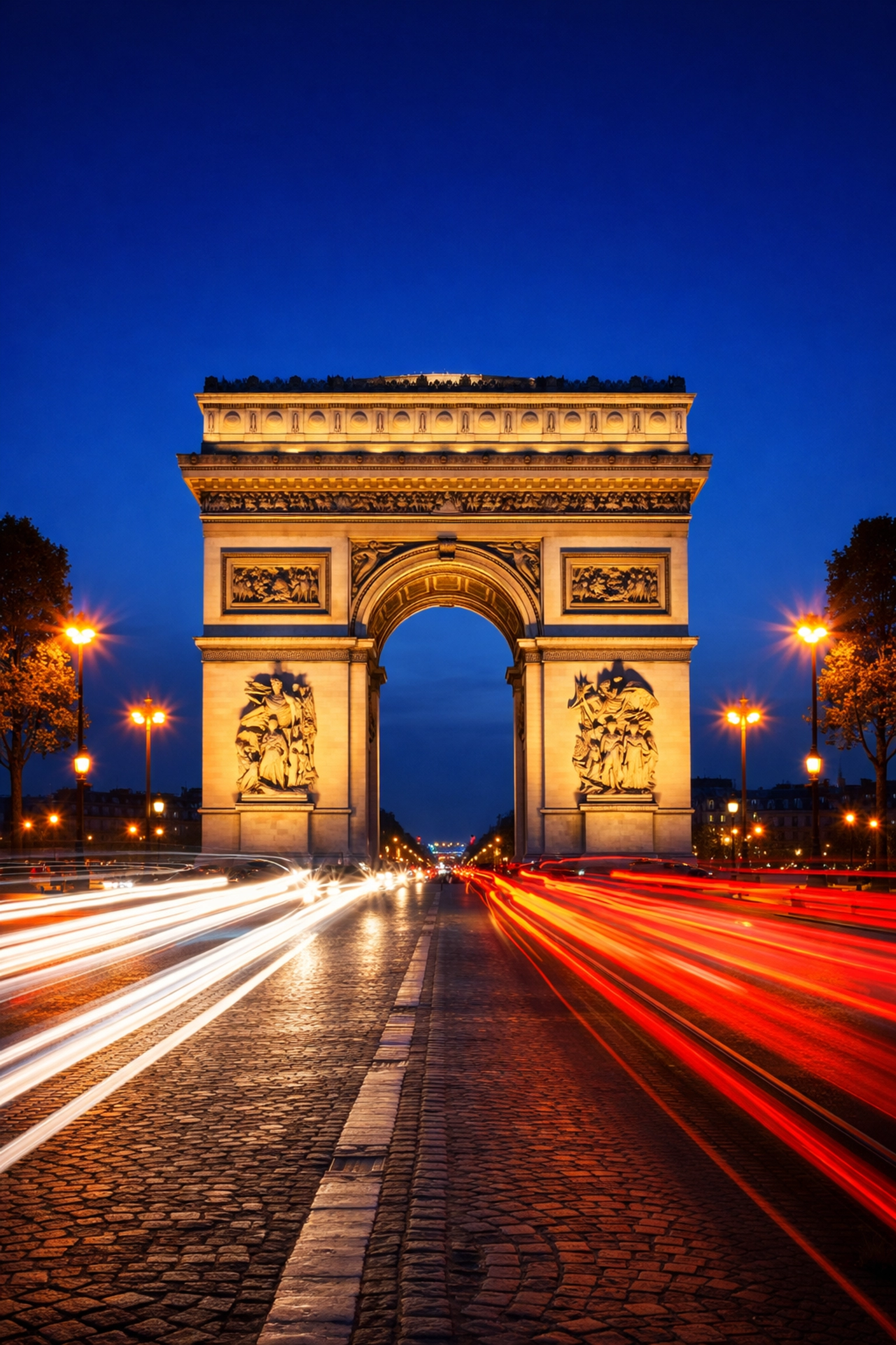 Arc de Triomphe in Paris at night with light trails, a best photography spot for cityscapes.