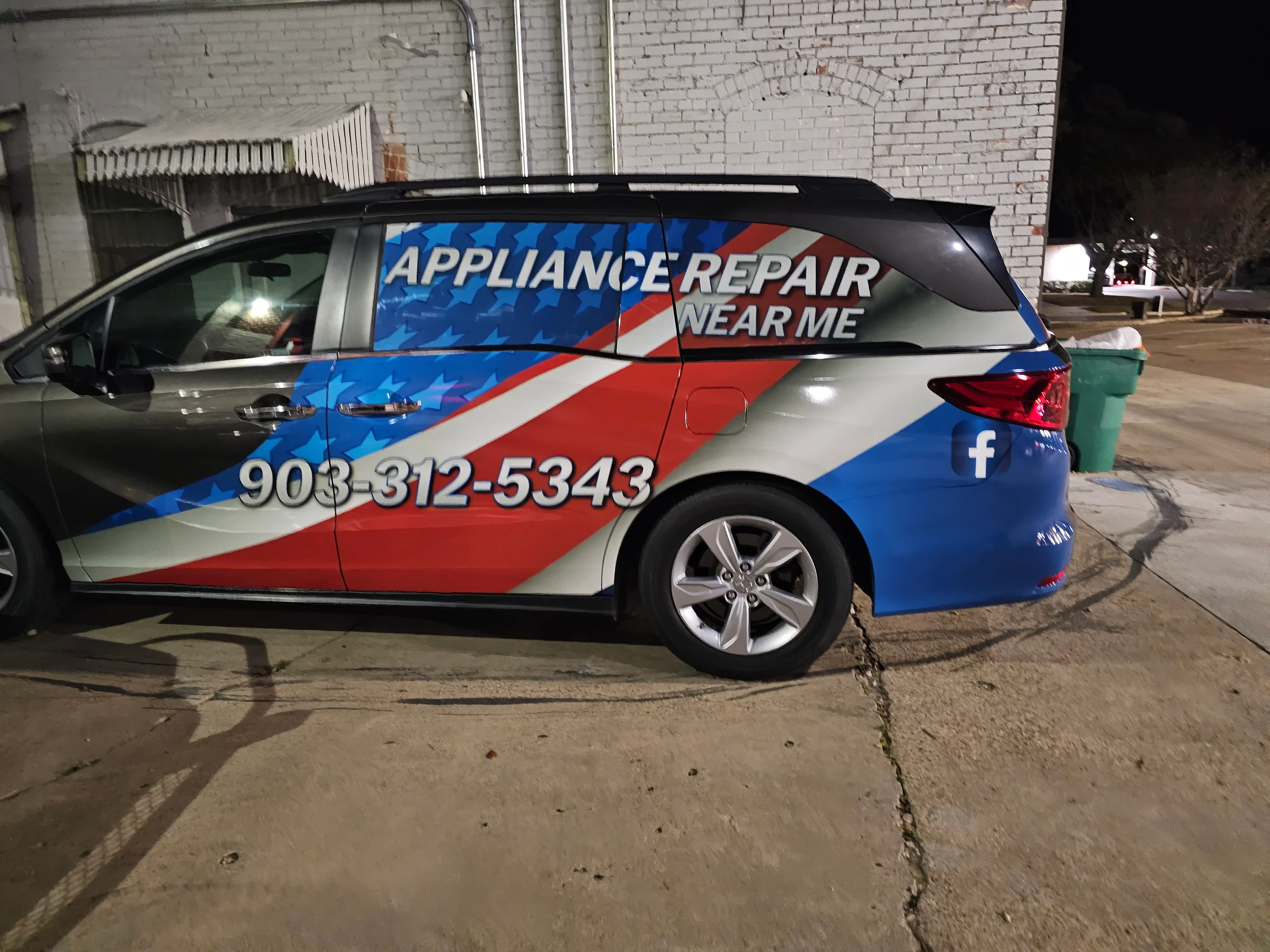 custom-car-wrap-patriotic-van.webp A professionally wrapped van showcasing a bold, patriotic design with stars and stripes, featuring “APPLIANCE REPAIR NEAR ME,” a large phone number, and a Facebook logo.