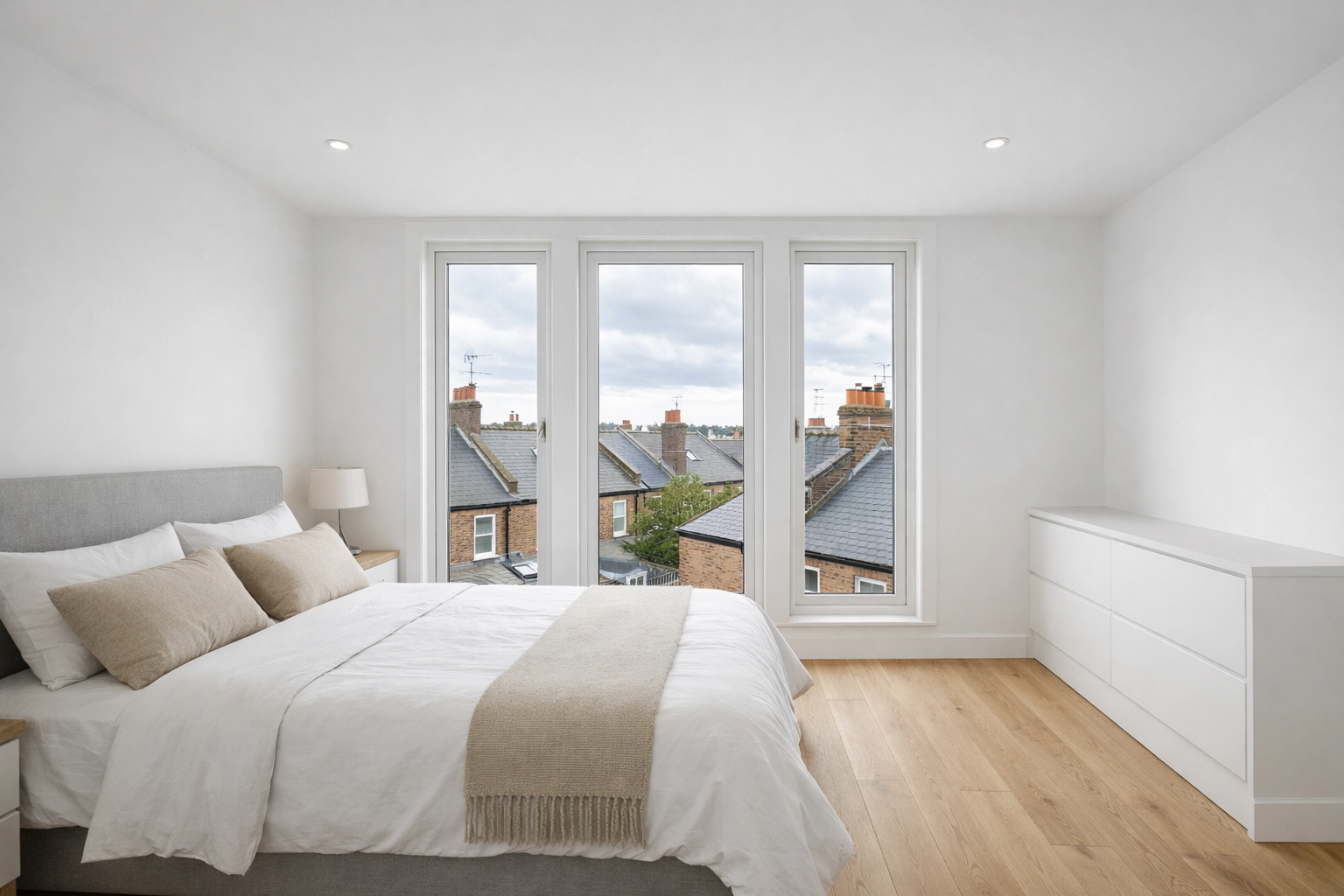 Modern Dormer loft conversion master bedroom in a London Victorian home with full head height.