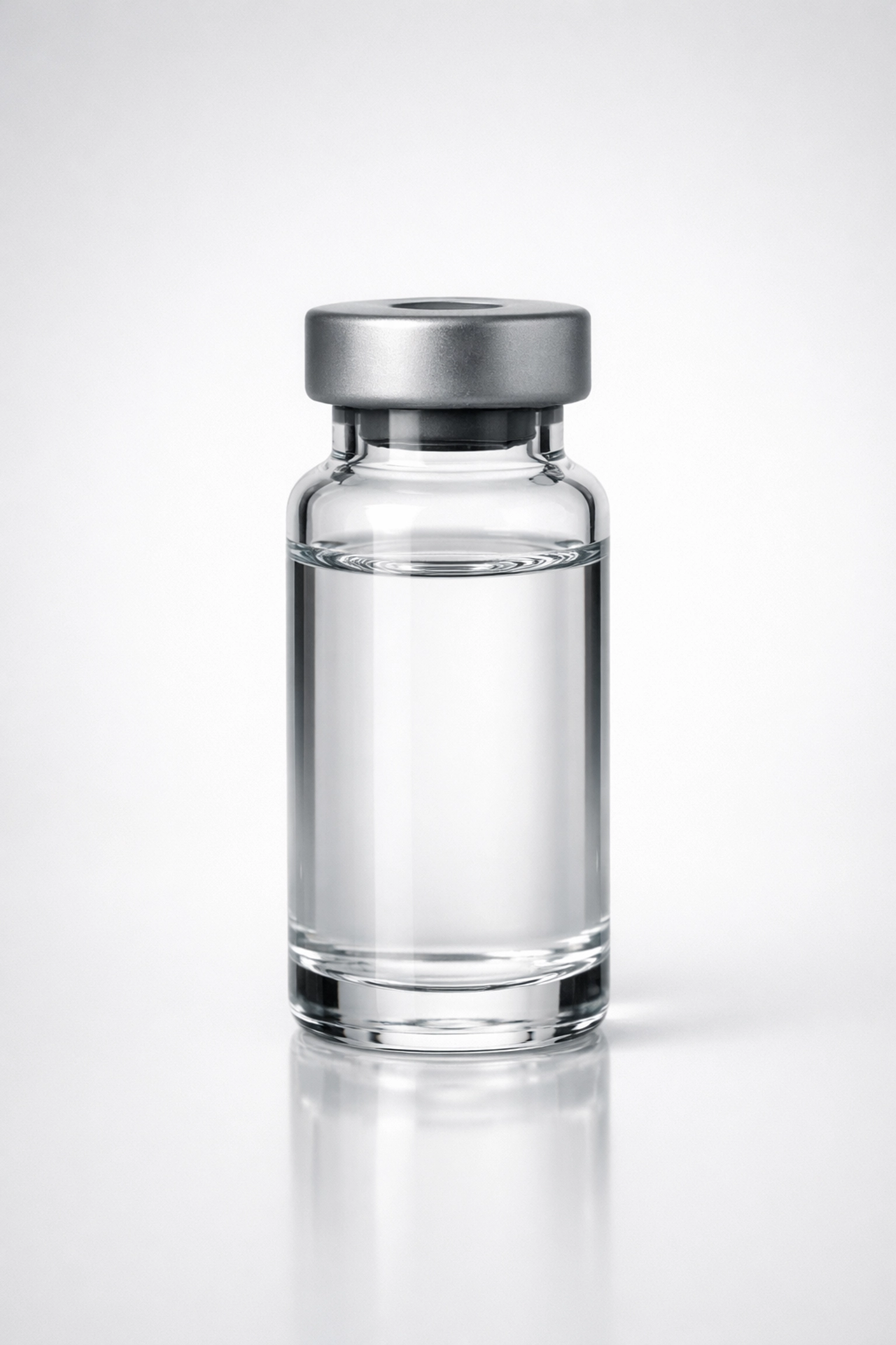 Clear reconstituted peptide solution in a glass vial after using a dosing calculator.