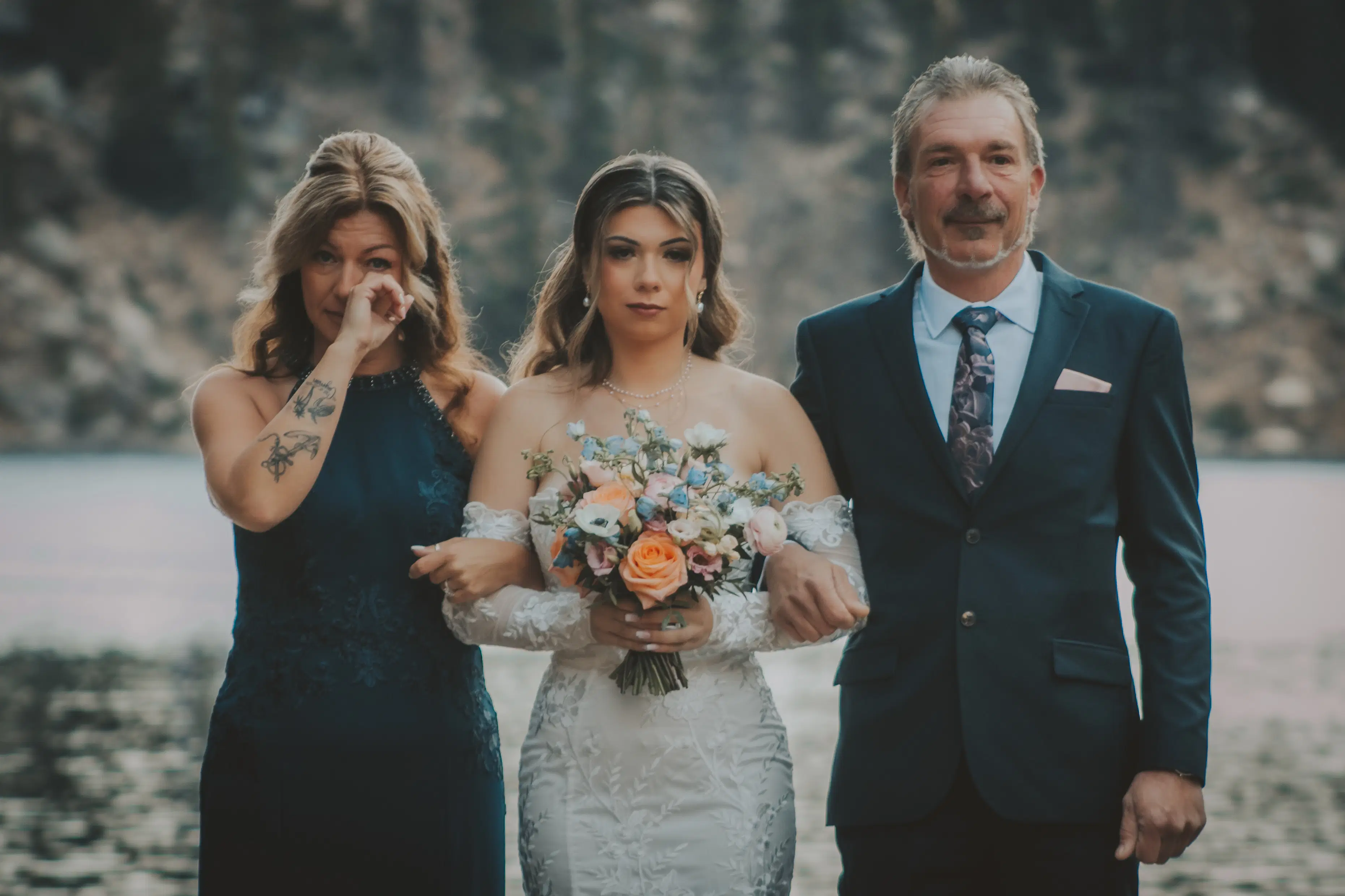emotional-family-walk-banff-wedding.webp