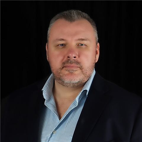 Professional Business Broker in Florida - Business Broker Dave Headshot A professional business broker in formal attire stands against a dark background, ready to assist Florida business owners with confidential business sales, strategic positioning, and transaction management. The image conveys experience, reliability, and a commitment to professional service for business owners and buyers.