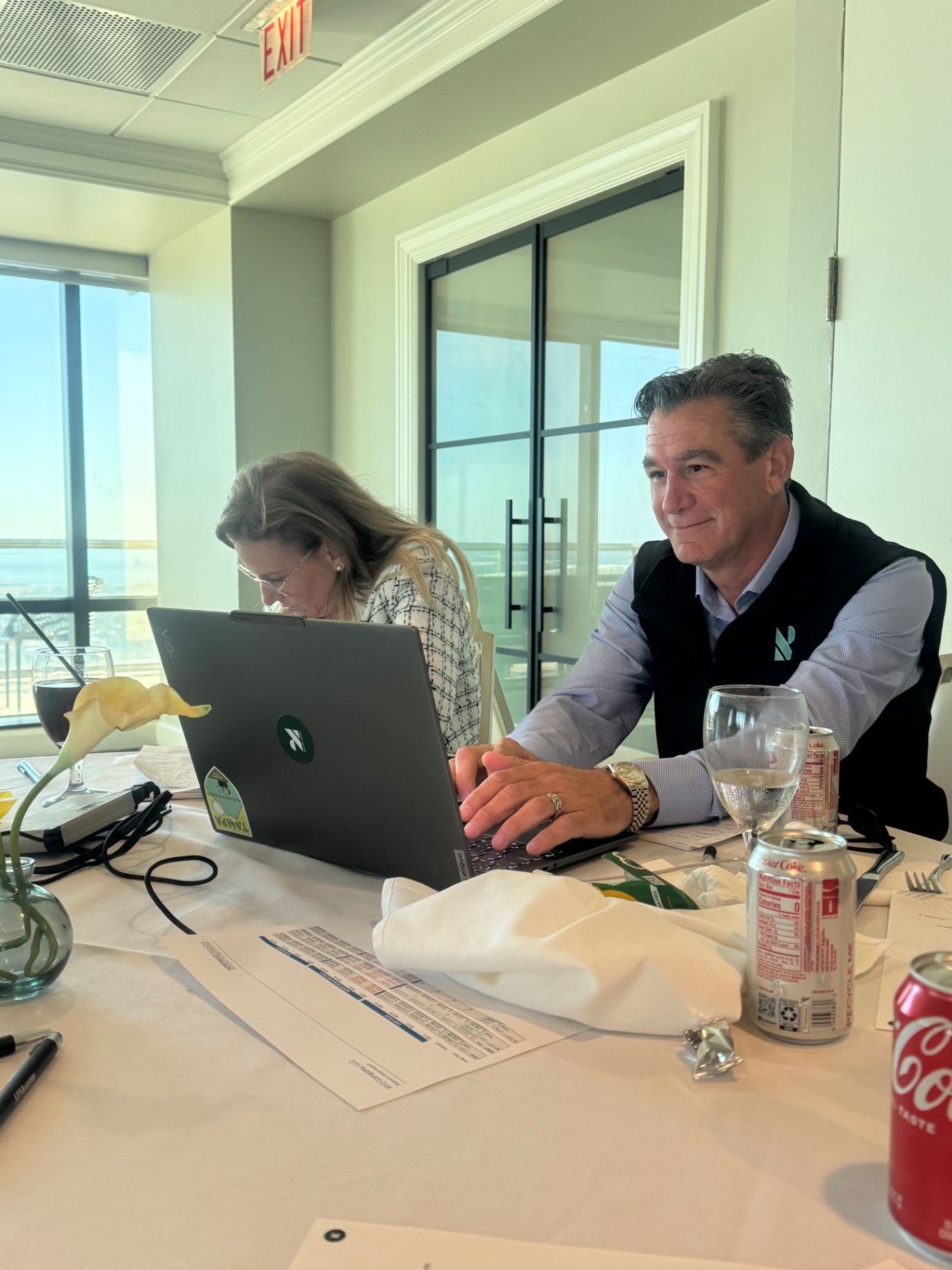 Leadership meeting scene illustrating strategic planning around executive benefits and long-term retention.