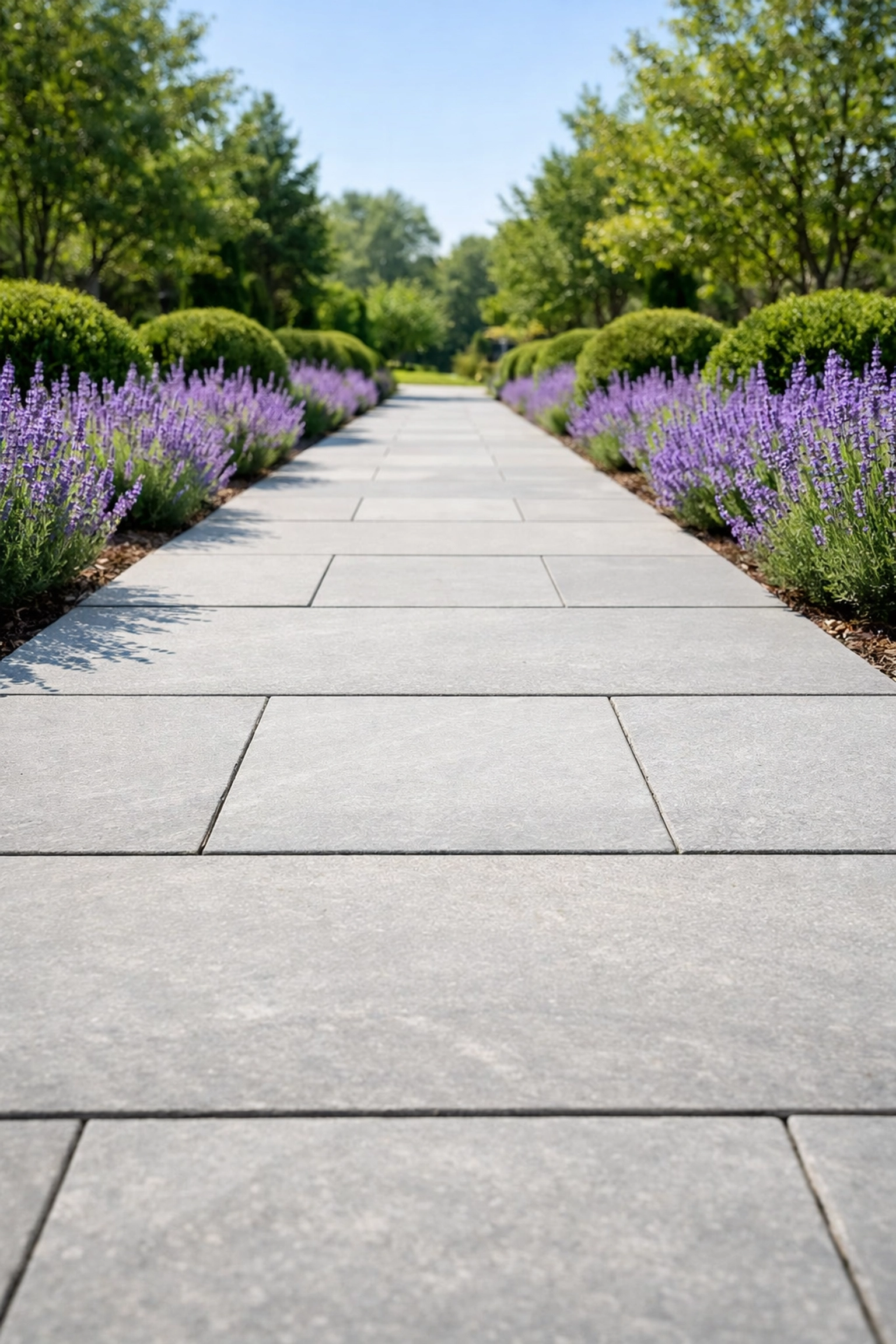 Wide and level garden pathway with flat paving stones for senior fall prevention.