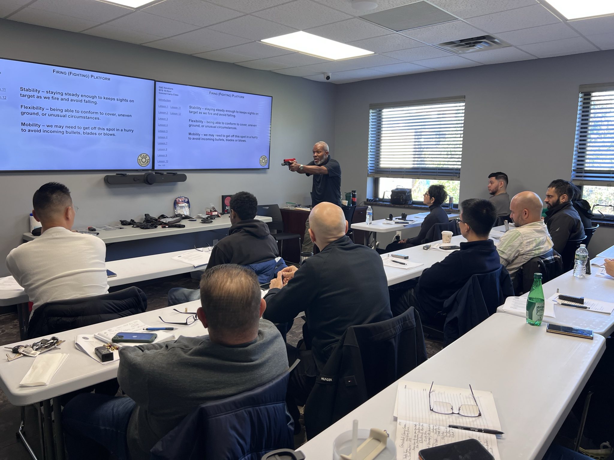 Instructor demonstrating firearms handling techniques