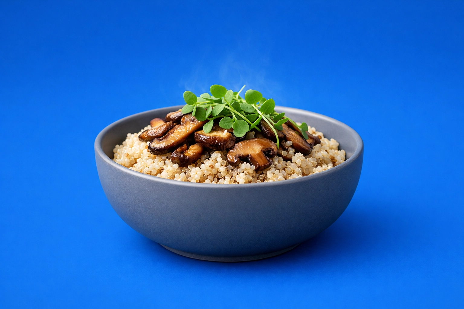 Savory quinoa and mushroom bowl serving as a low-glycemic breakfast to prevent mid-day energy slumps.