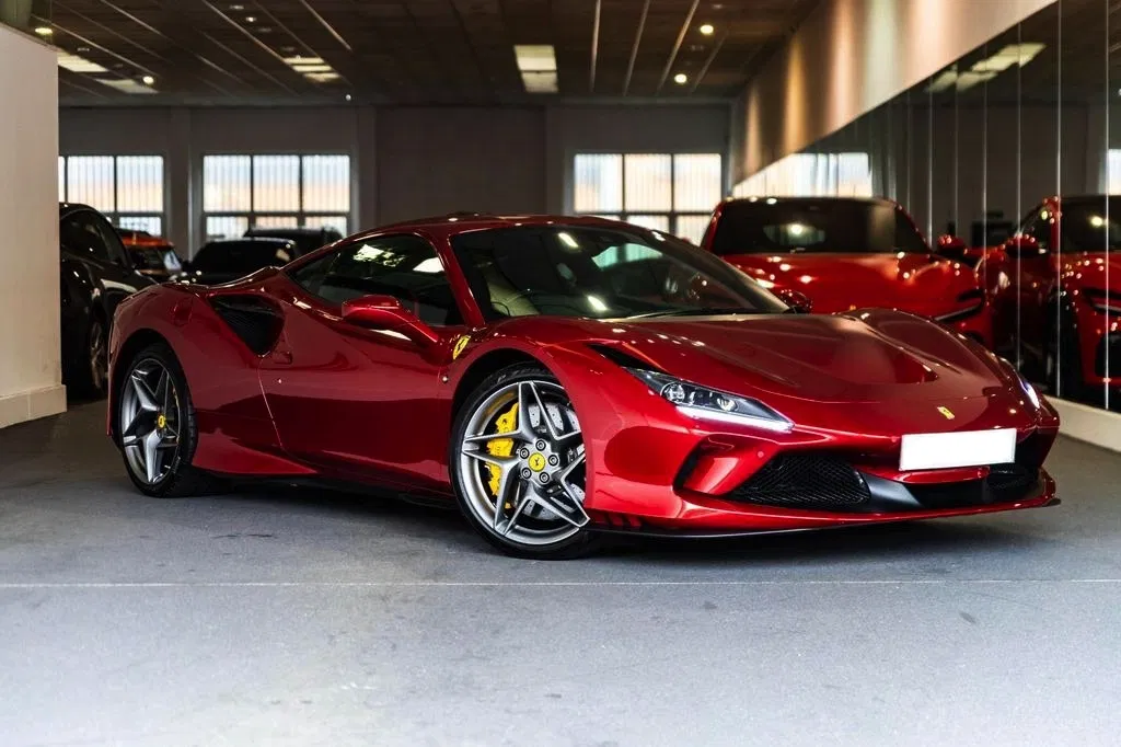 Gleaming red Ferrari sports car, symbolizing exclusivity and premium quality without long-term commitment