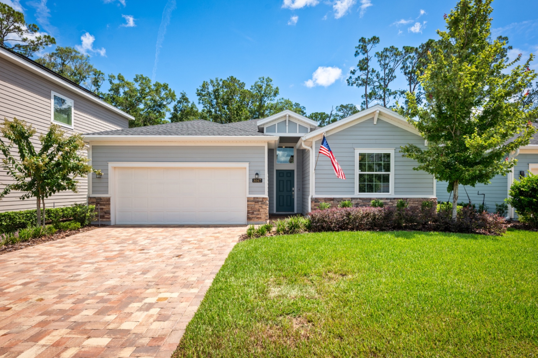 Bright, MLS-ready exterior photo of a modern single-story home