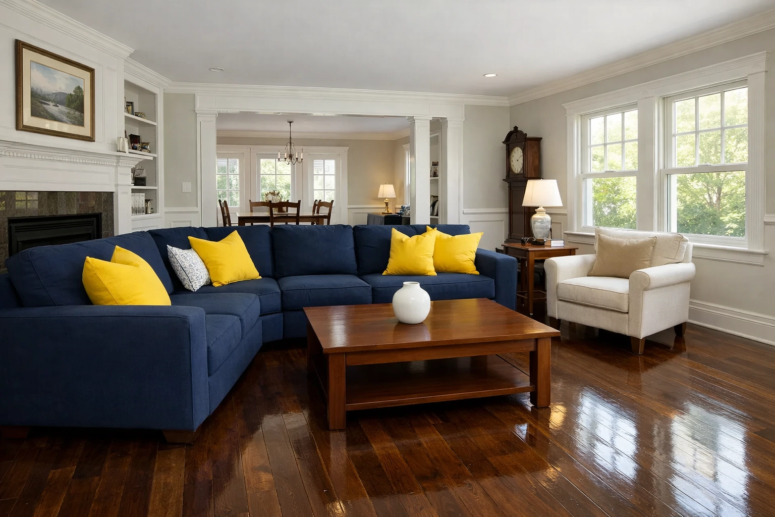 Spotless living room in a New England home featuring clean hardwood floors and dusted surfaces.
