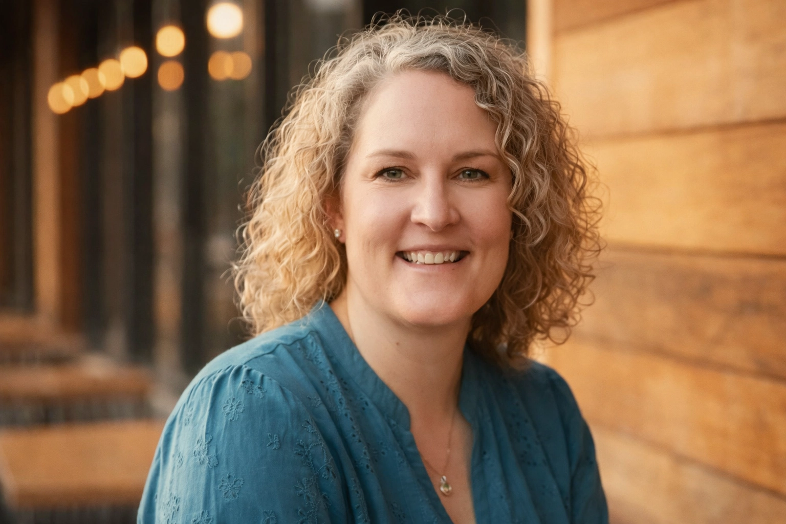 Portrait of Shawna L. Stevens in a teal blouse