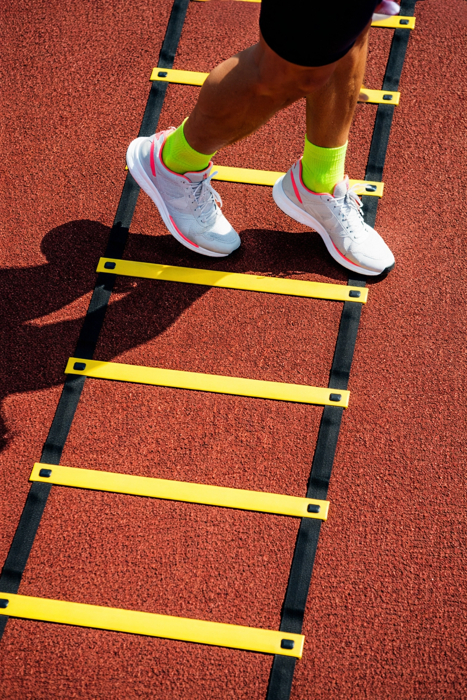Overhead view of athlete performing Icky Shuffle drill on a speed ladder to enhance agility and coordination