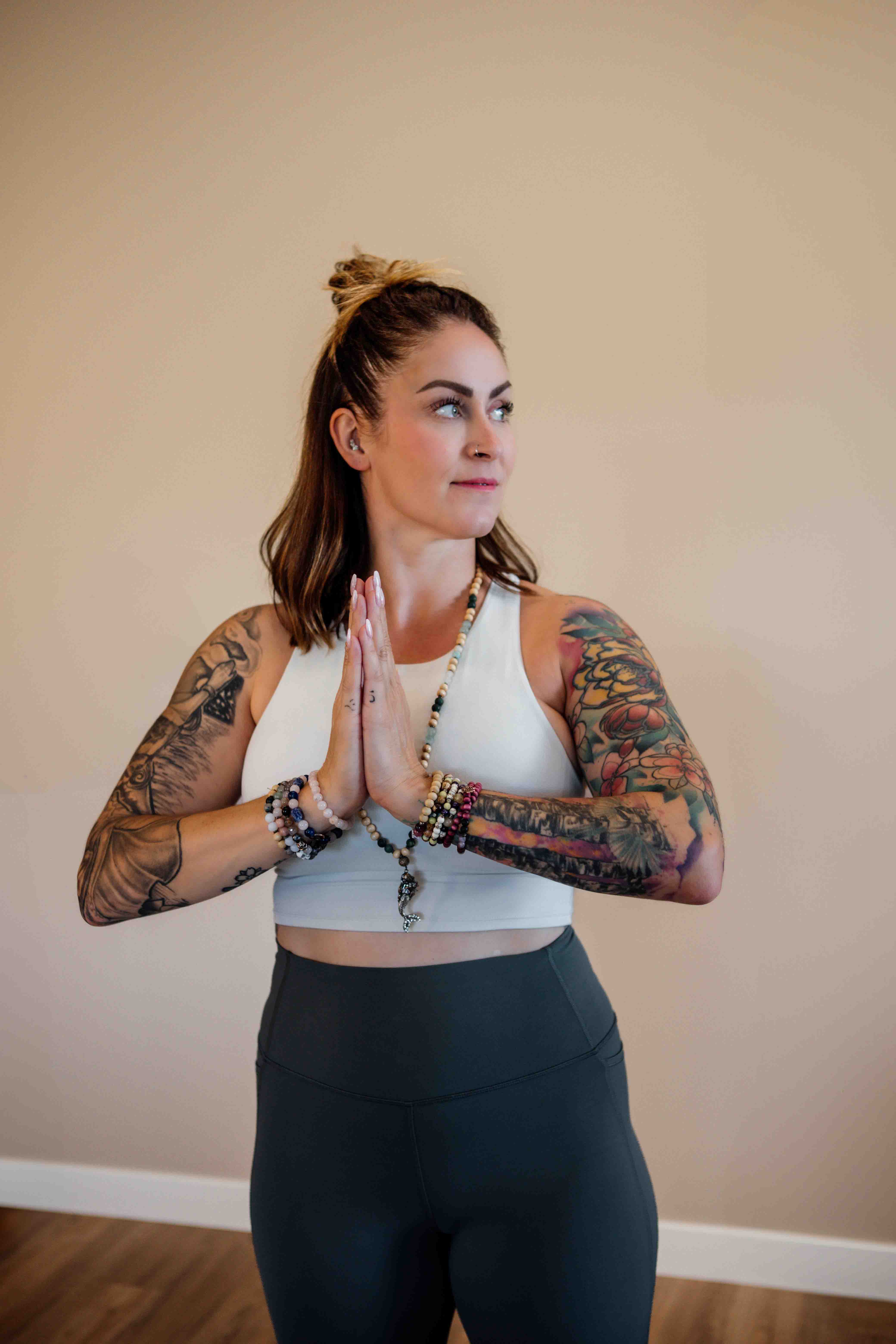 Midlife woman pausing to check in with her body before starting a mindful practice